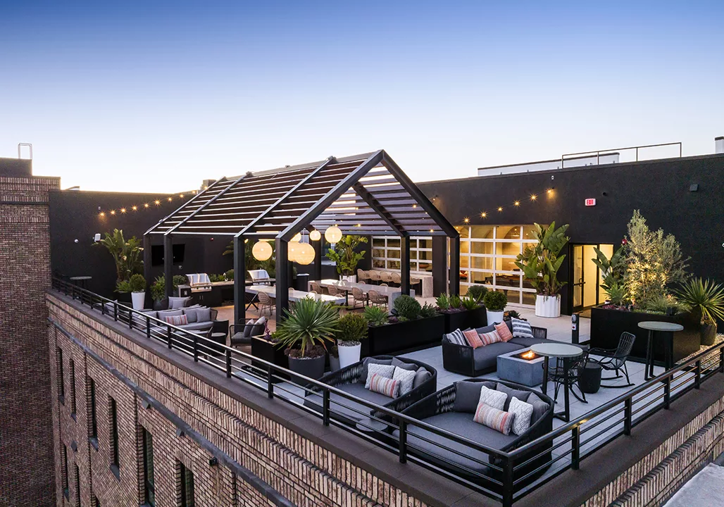 Rooftop lounge with seating and bar